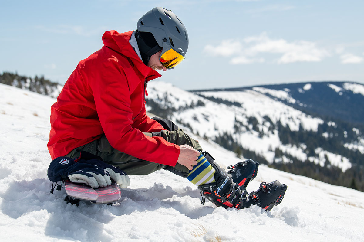 Intermediate skis (putting on ski boots)